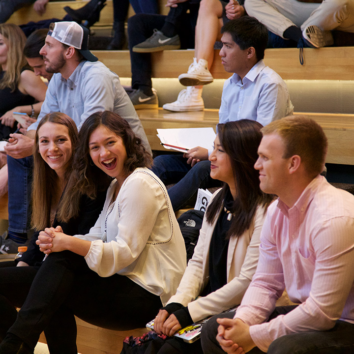 Instructors seated in an auditorium