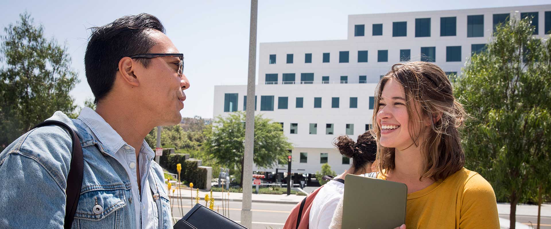 Two students talking outside of the Playa Vista Campus