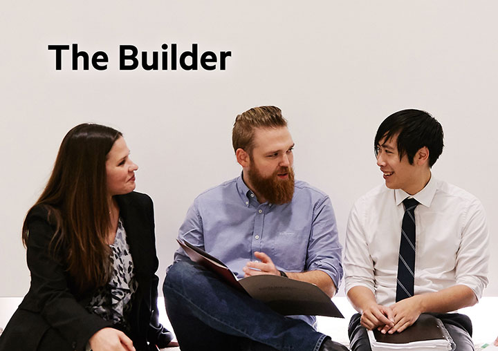 Students in professional attire discussing class notes with the words The Builder